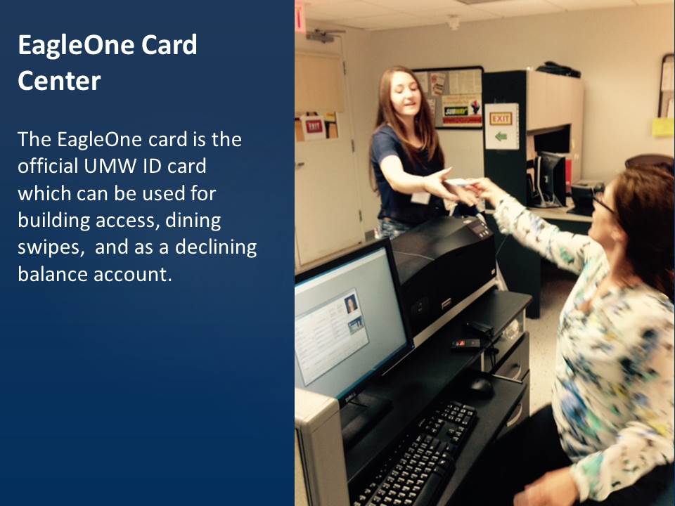 An employee hands a student a newly printer EagleOne card.