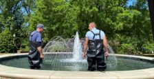 Plumbers working on a water fountain